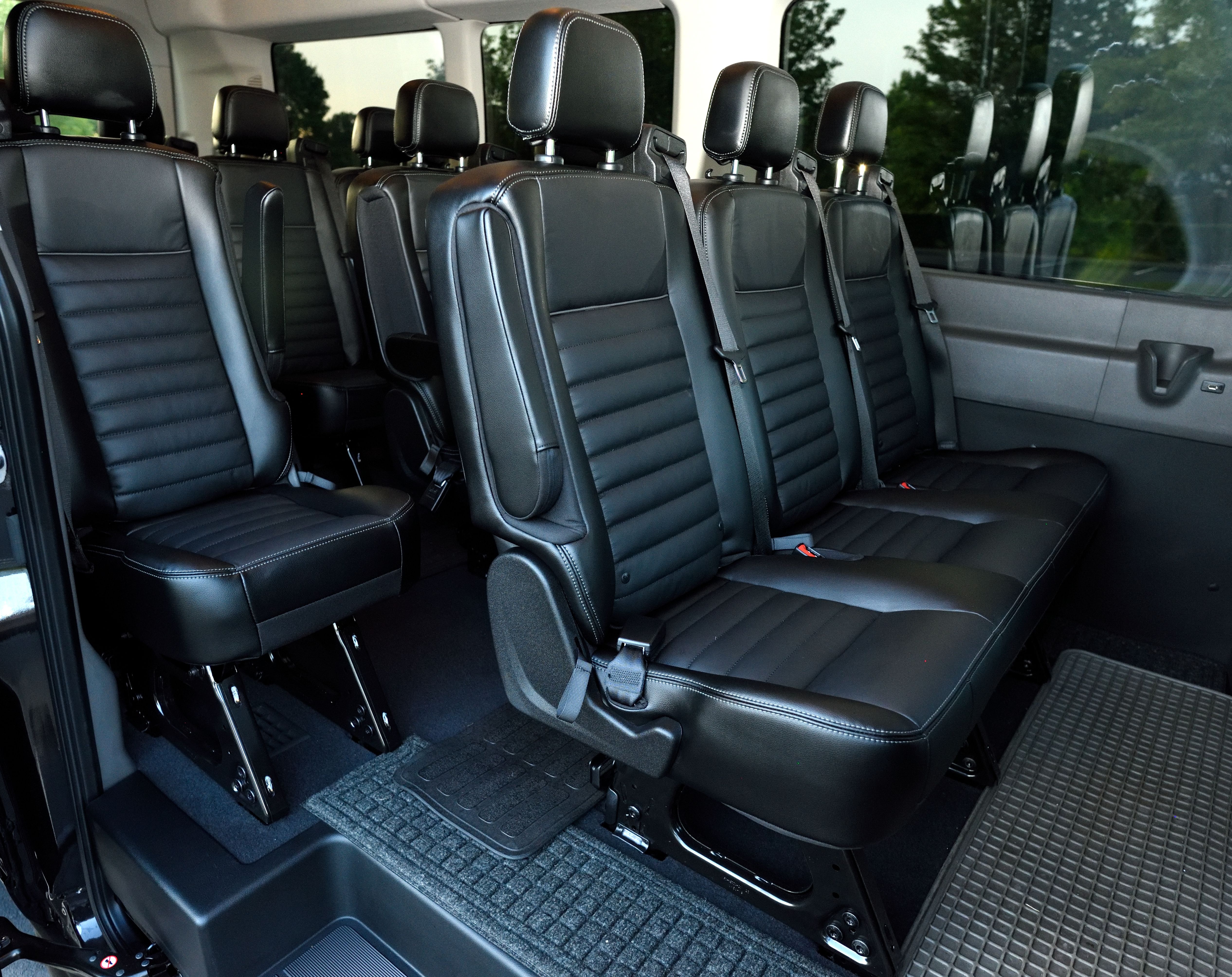 Spacious interior of our Ford Transit &ndash; comfortable seating with room for the whole group