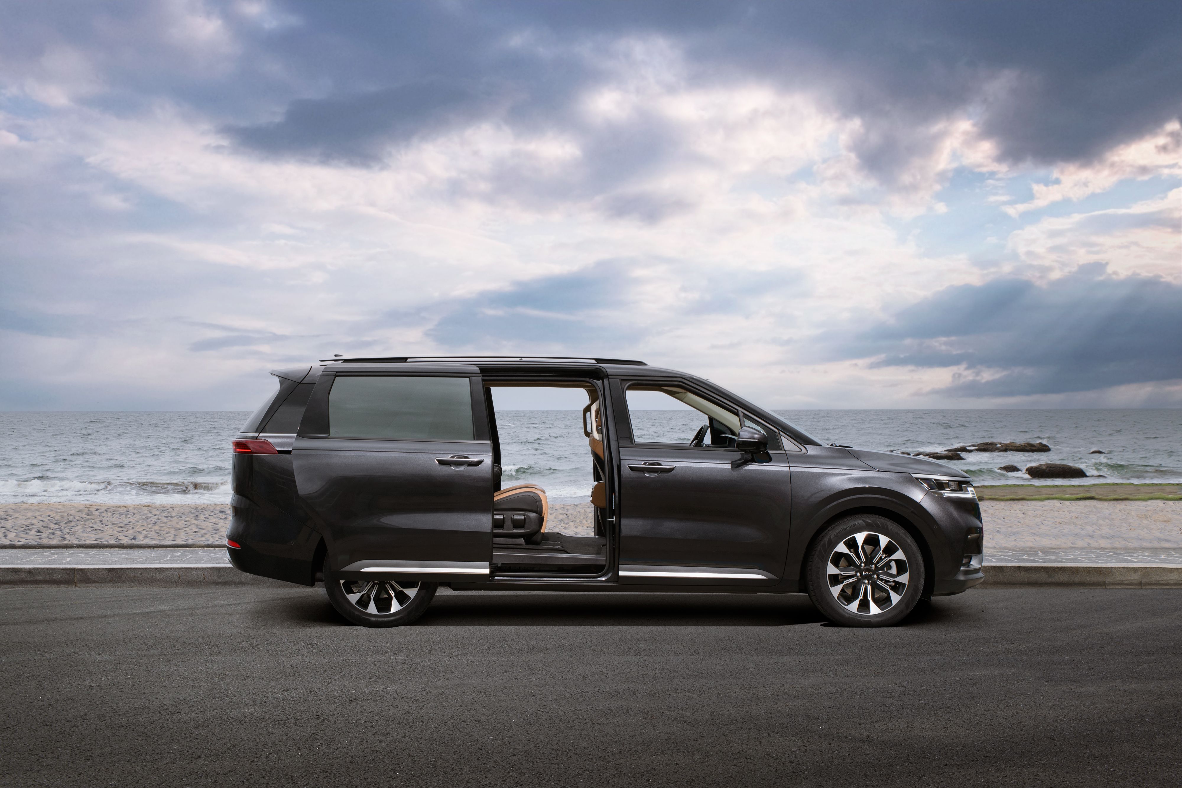 Kia Carnival MPV with open sliding door &ndash; family transportation